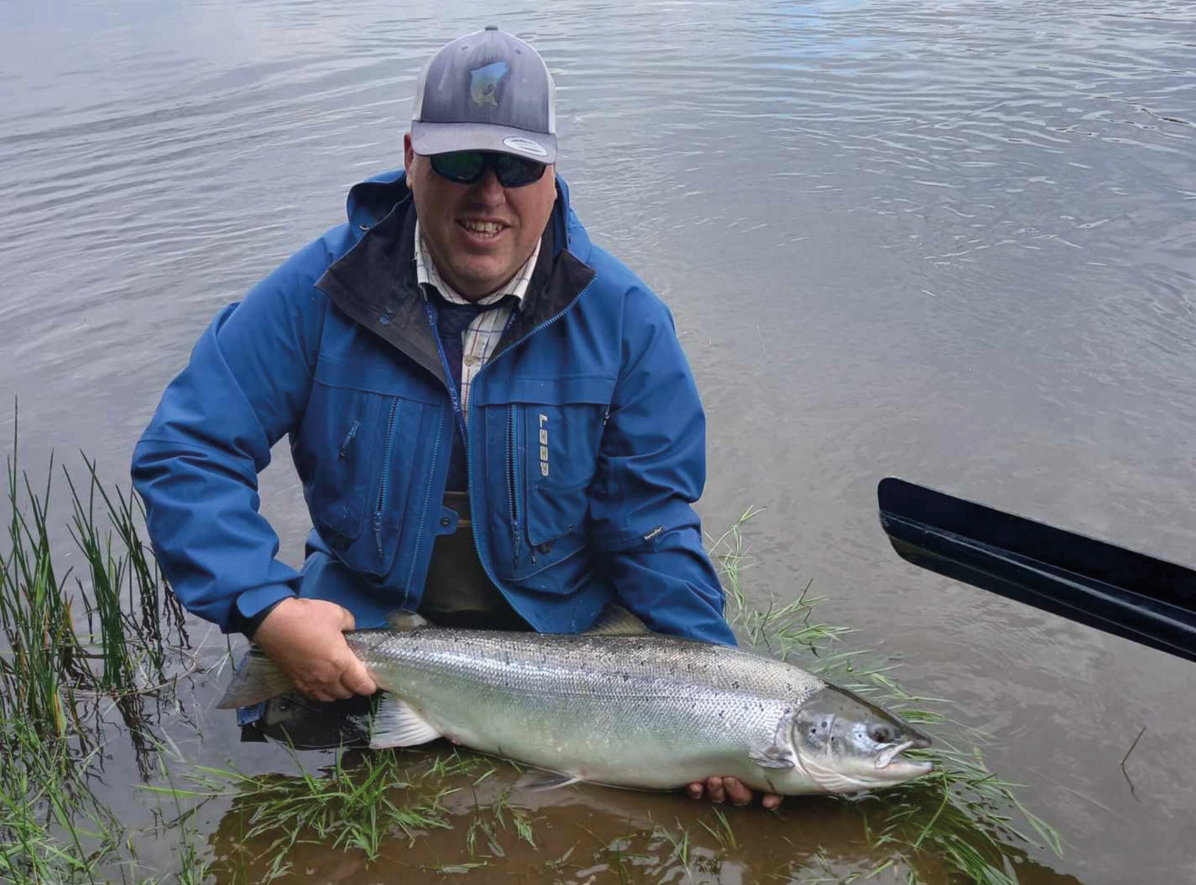Head Ghillie Martin Ritchie holding a salmon caught on the Tweed